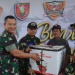 Ketua Umum Dharma Pertiwi Serahkan Bantuan Paket Sembako untuk Masyarakat Amborawang
